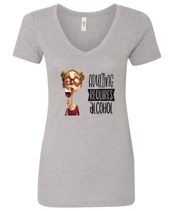 silver wine v-neck t-shirt featuring a young drunk woman wearing glasses holding a glass of wine and it says adulting requires alcohol