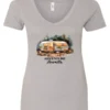 silver camping v-neck t-shirt featuring a camper in the woods in the night with open doors with a quote saying adventure awaits