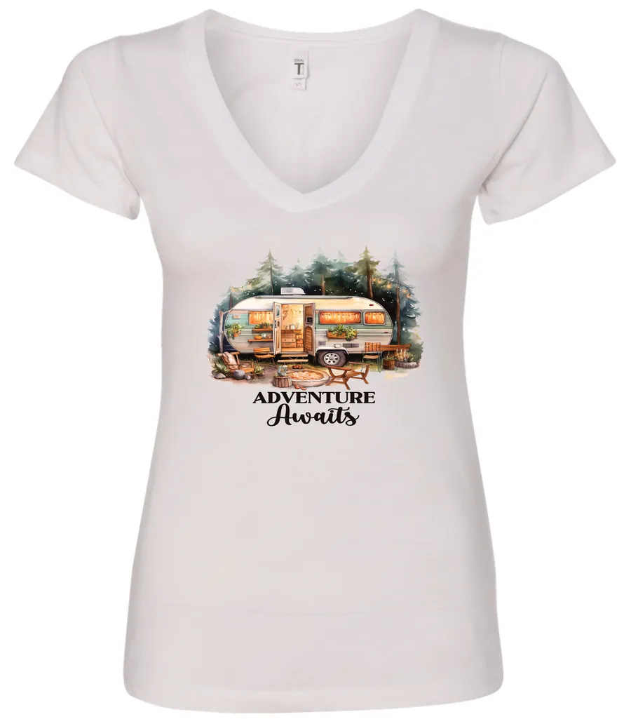 white camping v-neck t-shirt featuring a camper in the woods in the night with open doors with a quote saying adventure awaits