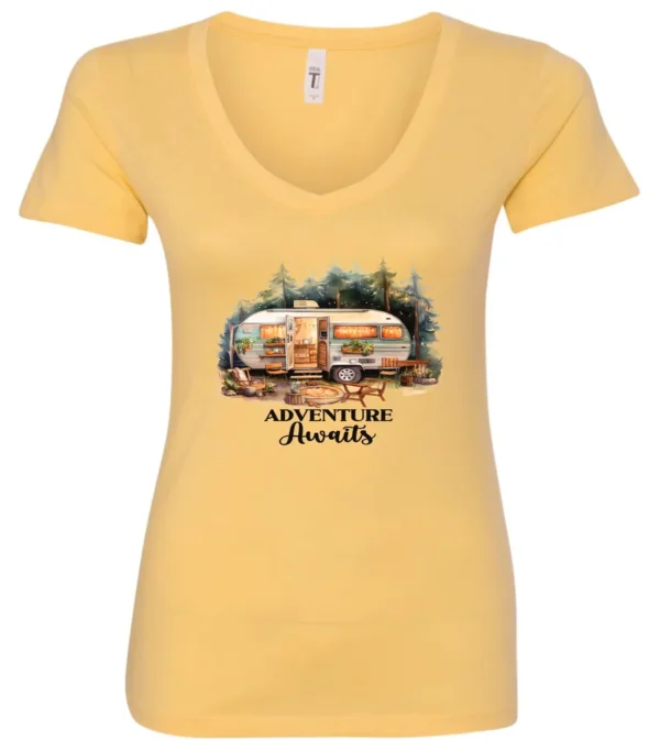 yellow camping v-neck t-shirt featuring a camper in the woods in the night with open doors with a quote saying adventure awaits