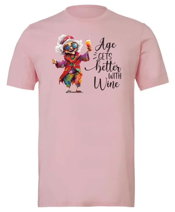 pink funny wine t-shirt featuring a happy old hippie woman with funny glasses holding a cocktail and it says age gets better with wine