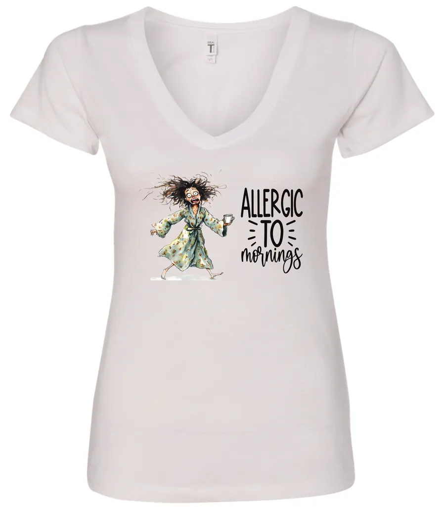 white funny coffee v-neck t-shirt featuring a disheveled woman with scared face running in pajamas and a cup of coffee, it says allergic to mornings
