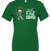 green coffee addict t-shirt featuring a disheveled young woman with surprised face in pajamas and a cup of coffee, it says but first coffee