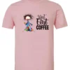 pink coffee addict t-shirt featuring a disheveled young woman with surprised face in pajamas and a cup of coffee, it says but first coffee