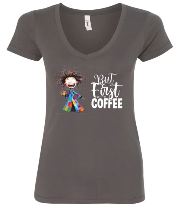 gray coffee addict v-neck t-shirt featuring a disheveled young woman with surprised face in pajamas and a cup of coffee, it says but first coffee