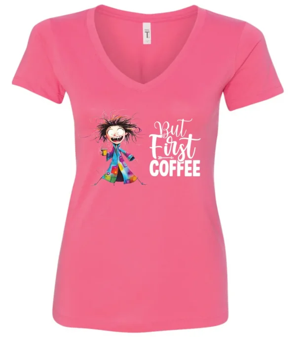 pink coffee addict v-neck t-shirt featuring a disheveled young woman with surprised face in pajamas and a cup of coffee, it says but first coffee