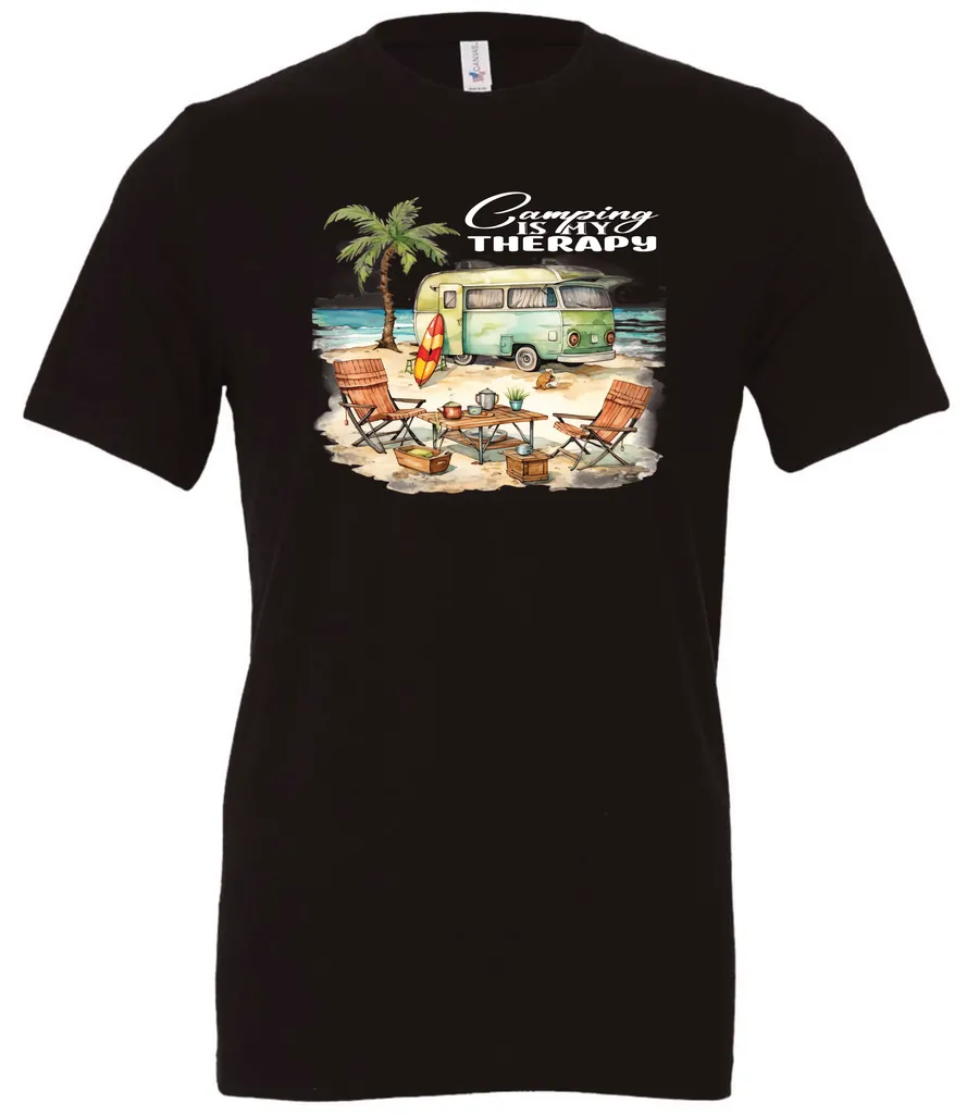 black funny camping t-shirt featuring a green camper in the beach with a red and yellow kayak outside with a quote saying camping is my therapy