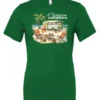 green funny camping t-shirt featuring a green camper in the beach with a red and yellow kayak outside with a quote saying camping is my therapy