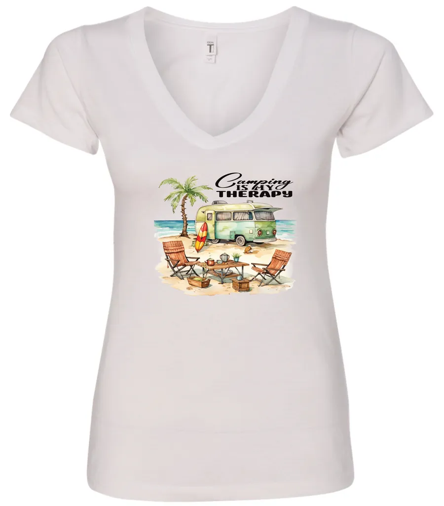 white funny camping v-neck t-shirt featuring a green camper in the beach with a red and yellow kayak outside with a quote saying camping is my therapy