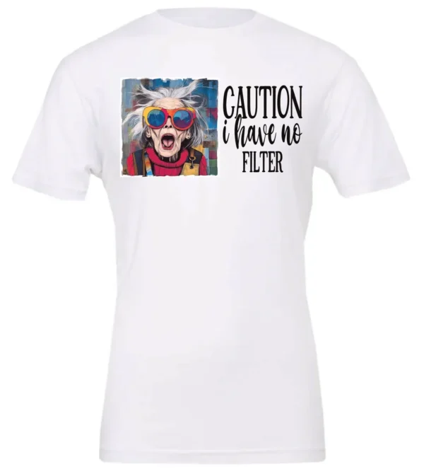 white sarcasm t-shirt featuring a funny design of a disheveled older woman with white hair and big glasses, saying Caution: I have no filter