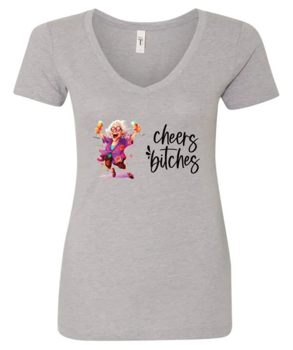 silver funny cocktail v-neck t-shirt featuring a drunk old woman with glasses dancing and holding a glass of cocktail in each hand and it says cheers bitches