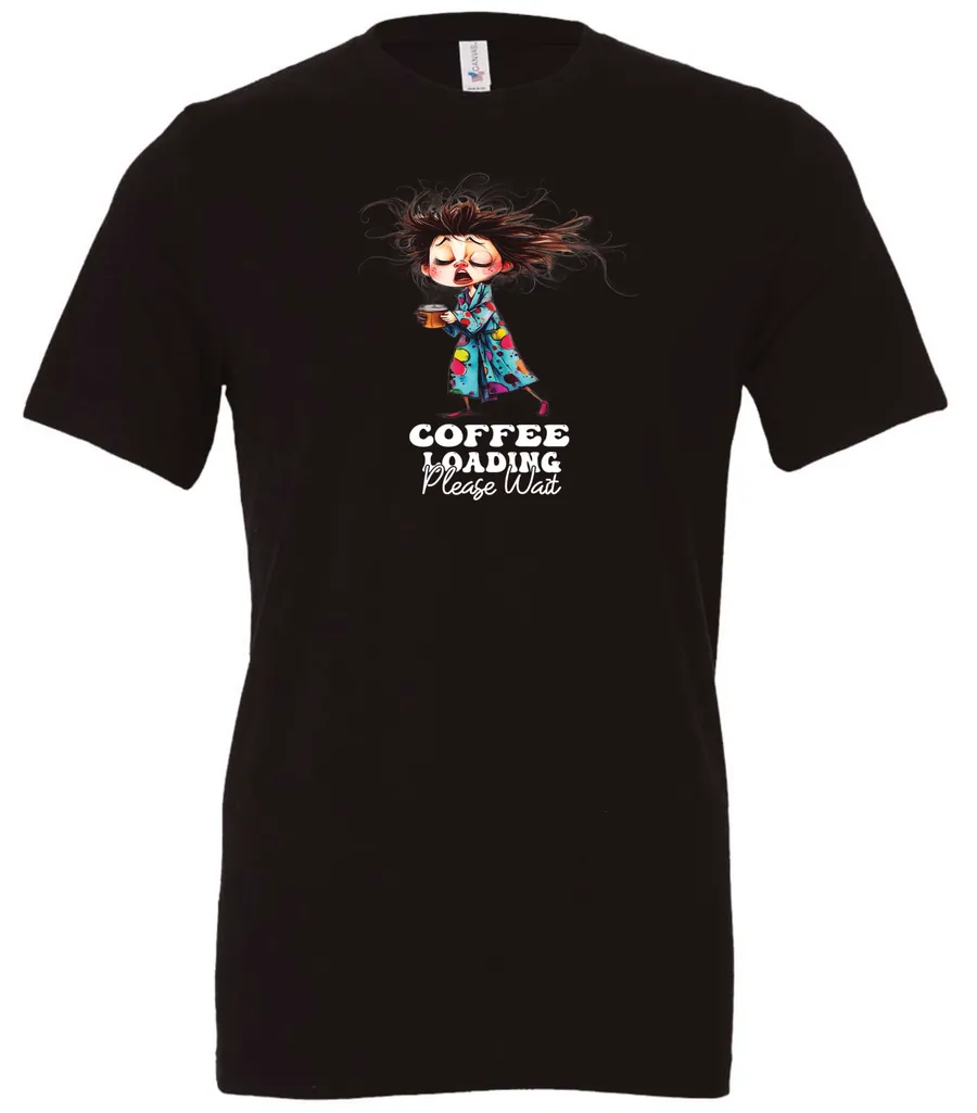 black coffee t-shirt featuring a disheveled young woman with eyes closed in pajamas with a cup of coffee, it says coffee loading please wait