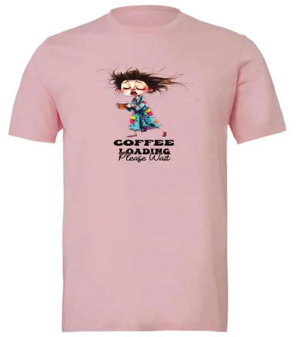 pink coffee t-shirt featuring a disheveled young woman with eyes closed in pajamas with a cup of coffee, it says coffee loading please wait