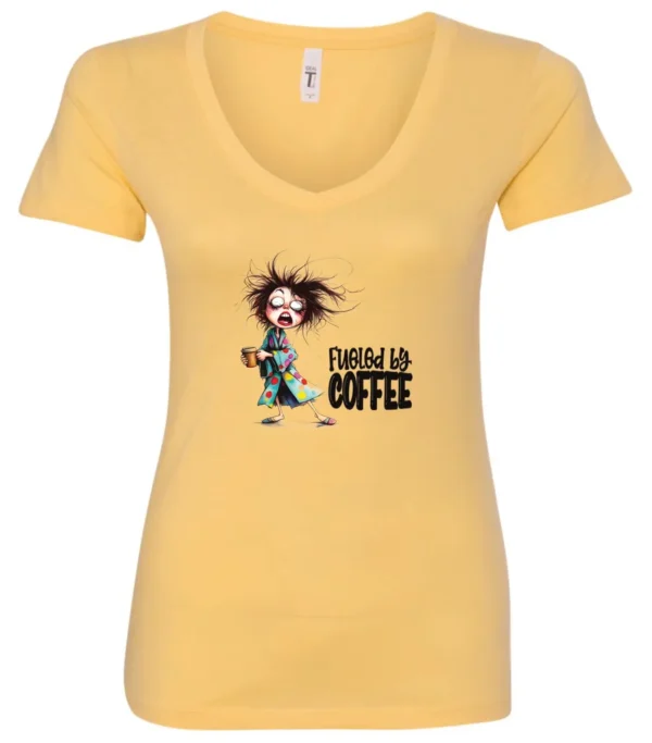 yellow coffee lover v-neck t-shirt featuring a disheveled young woman who just woke up in pajamas with a cup of coffee it says fueled by coffee