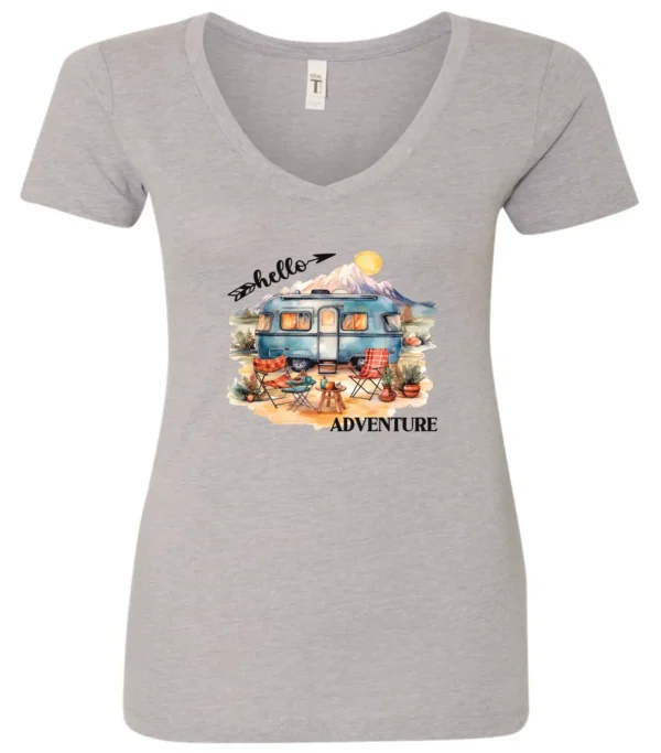 silver camping v-neck t-shirt featuring a camper, picnic table set outside, and a sunrise in the background, and it says hello adventure