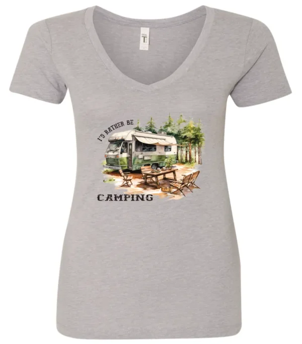 silver camping v-neck t-shirt featuring an old model camper in the woods with a table and chairs outside, and it says I’d rather be camping