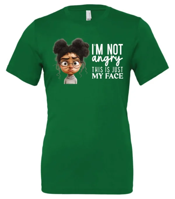 green funny sarcastic t-shirt featuring a young black girl with two hair buns, glasses and angry face saying I'm not angry, this is just my face