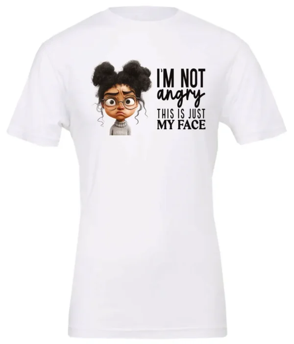 white funny sarcastic t-shirt featuring a young black girl with two hair buns, glasses and angry face saying I'm not angry, this is just my face