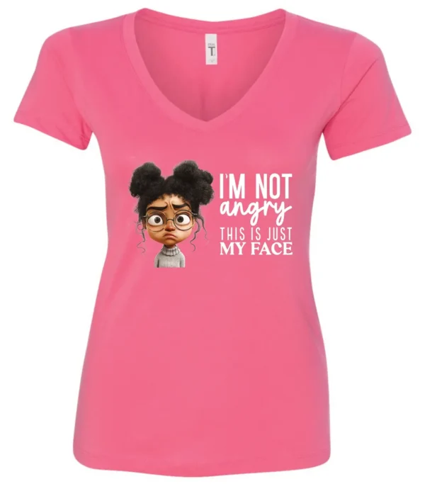 pink funny sarcastic v-neck t-shirt featuring a young black girl with two hair buns, glasses and angry face saying I'm not angry, this is just my face