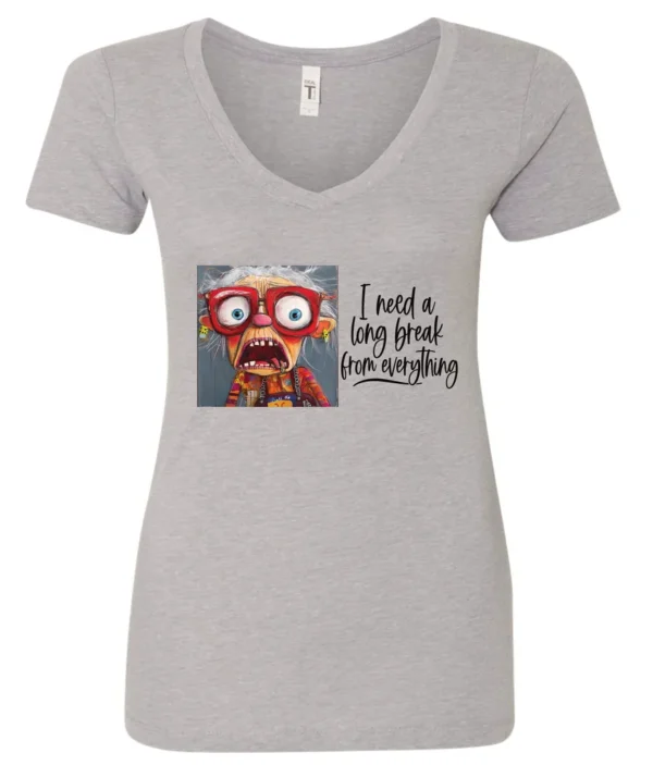 silver funny v-neck t-shirt featuring an elderly woman with a look of astonishment, missing some teeth, her mouth open and her tongue sticking out, saying I need a long break from everything