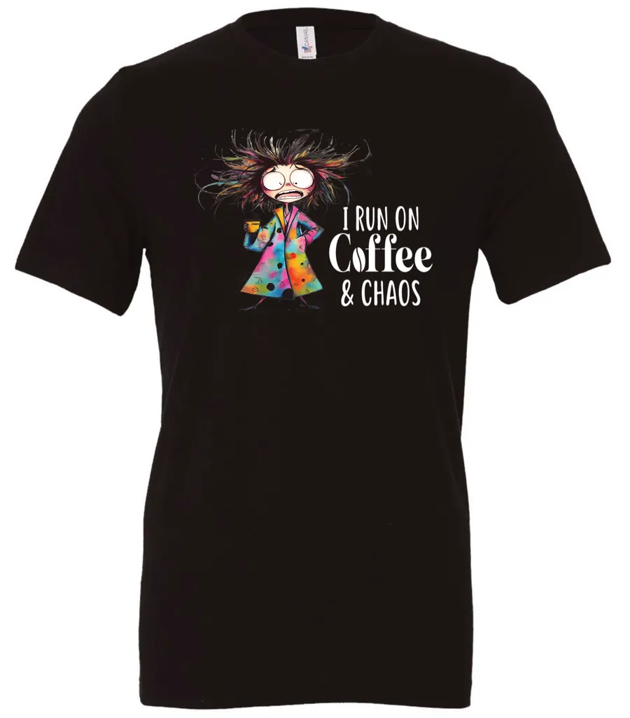 black caffeine t-shirt featuring a disheveled woman with a colorful coat mouth and eyes wide open and a cup of coffee it says I run on coffee and chaos