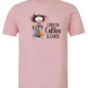 pink caffeine t-shirt featuring a disheveled woman with a colorful coat mouth and eyes wide open and a cup of coffee it says I run on coffee and chaos