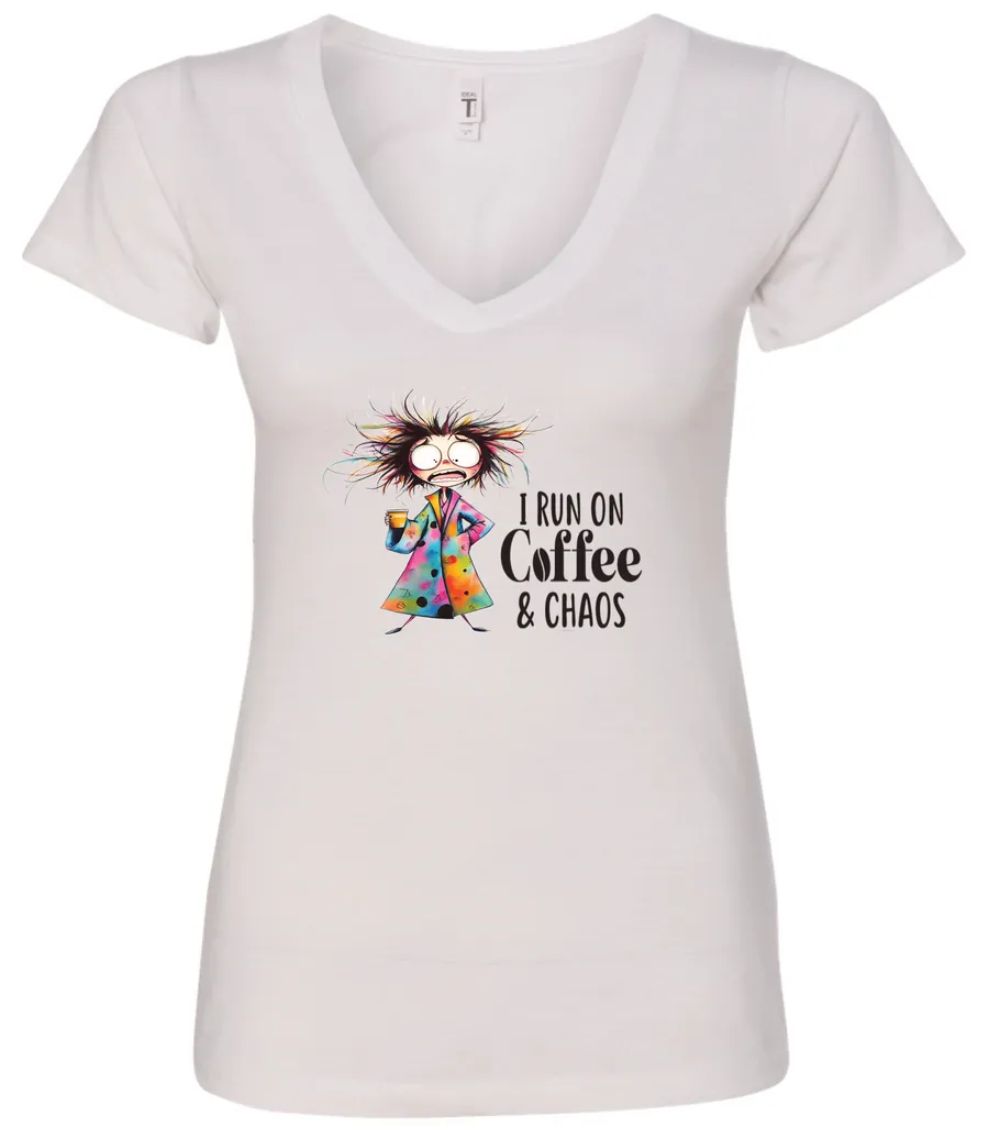 white caffeine v-neck t-shirt featuring a disheveled woman with a colorful coat mouth and eyes wide open and a cup of coffee it says I run on coffee and chaos