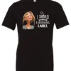 black humor t-shirt featuring a young blonde girl with an embarrassed face saying I should have a warning label