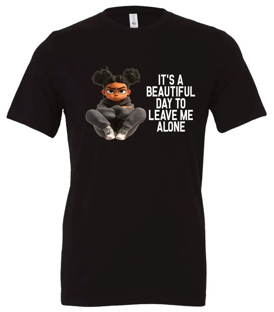 black sarcastic quote t-shirt featuring a young black girl with two hair buns, and mad face saying it’s a beautiful day to leave me alone