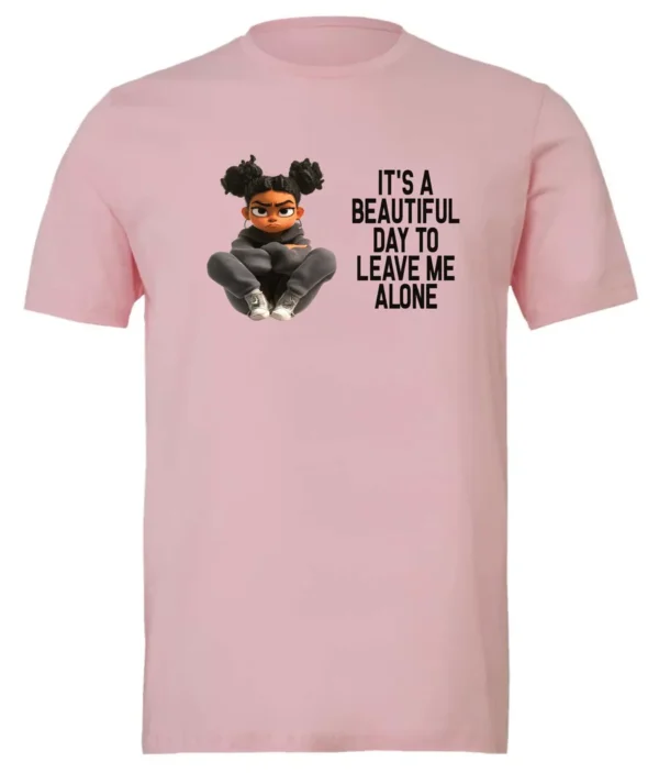 pink sarcastic quote t-shirt featuring a young black girl with two hair buns, and mad face saying it’s a beautiful day to leave me alone
