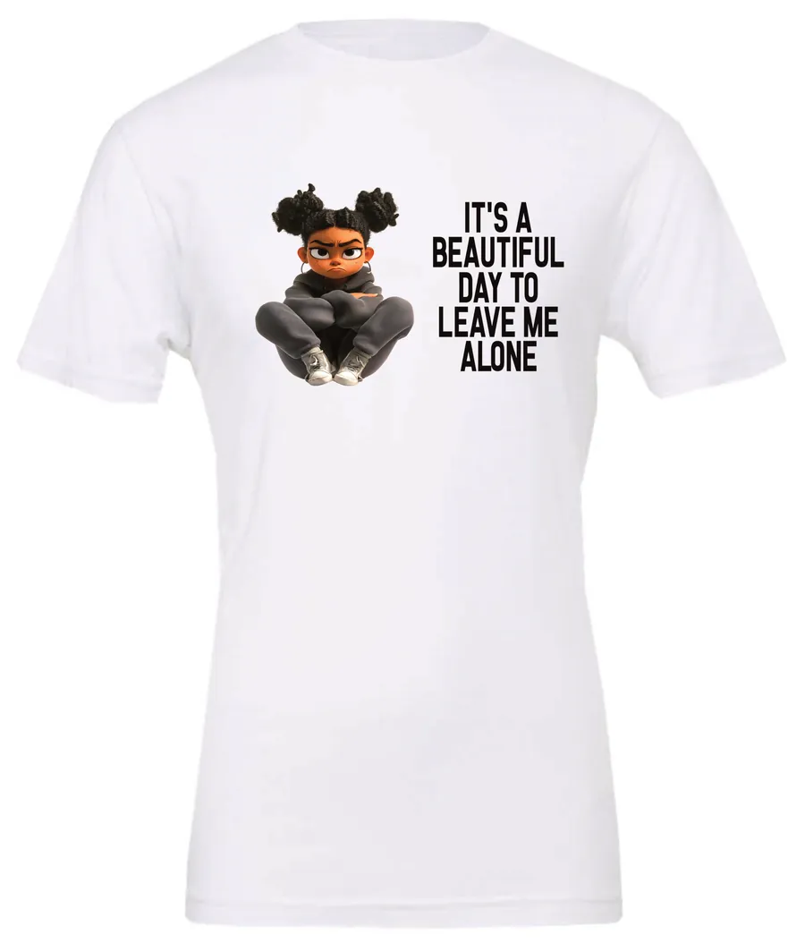 white sarcastic quote t-shirt featuring a young black girl with two hair buns, and mad face saying it’s a beautiful day to leave me alone