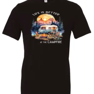 black campfire t-shirt featuring a camper by the lake, campfire on, and mountains with a sunset in the background, and it says life is better at the campfire.