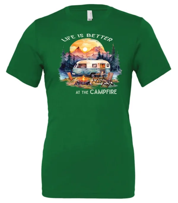 green campfire t-shirt featuring a camper by the lake, campfire on, and mountains with a sunset in the background, and it says life is better at the campfire.