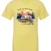 yellow campfire t-shirt featuring a camper by the lake, campfire on, and mountains with a sunset in the background, and it says life is better at the campfire.