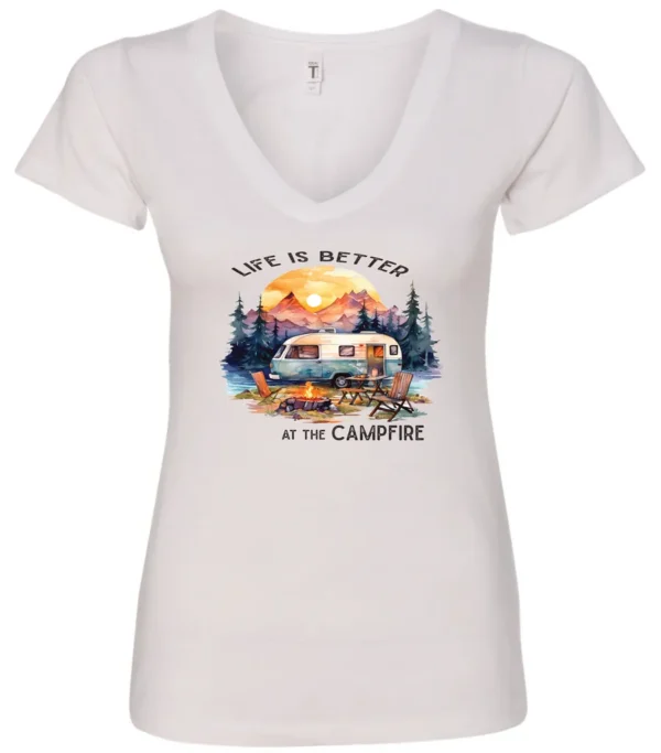 white campfire v-neck t-shirt featuring a camper by the lake, campfire on, and mountains with a sunset in the background, and it says life is better at the campfire.