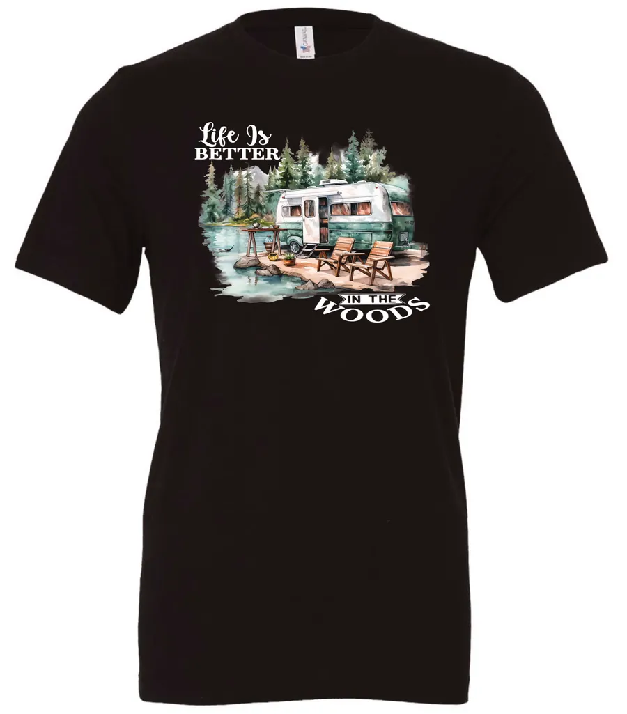 black Camping graphic t-shirt featuring a white and red old camper set up by the lake in the woods, and it says life is better in the woods