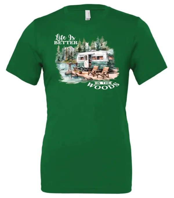green Camping graphic t-shirt featuring a white and red old camper set up by the lake in the woods, and it says life is better in the woods