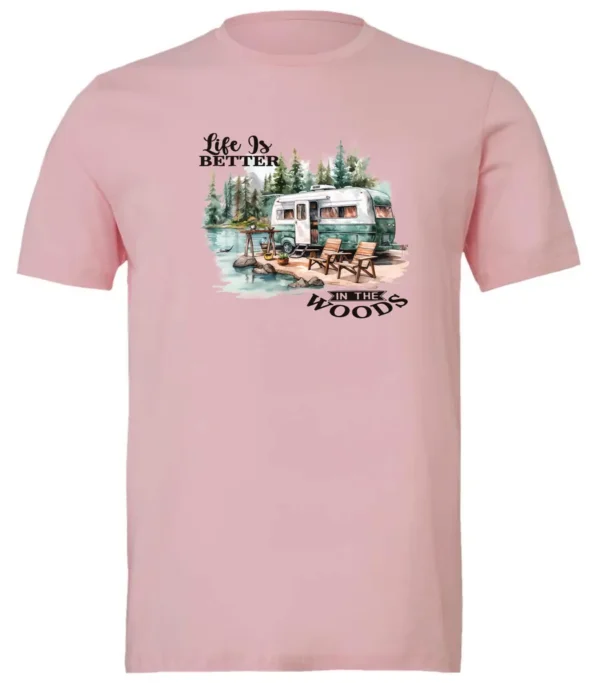 pink Camping graphic t-shirt featuring a white and red old camper set up by the lake in the woods, and it says life is better in the woods