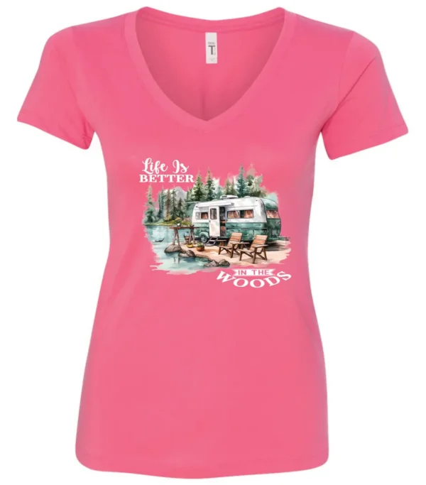 pink Camping graphic v-neck t-shirt featuring a white and red old camper set up by the lake in the woods, and it says life is better in the woods