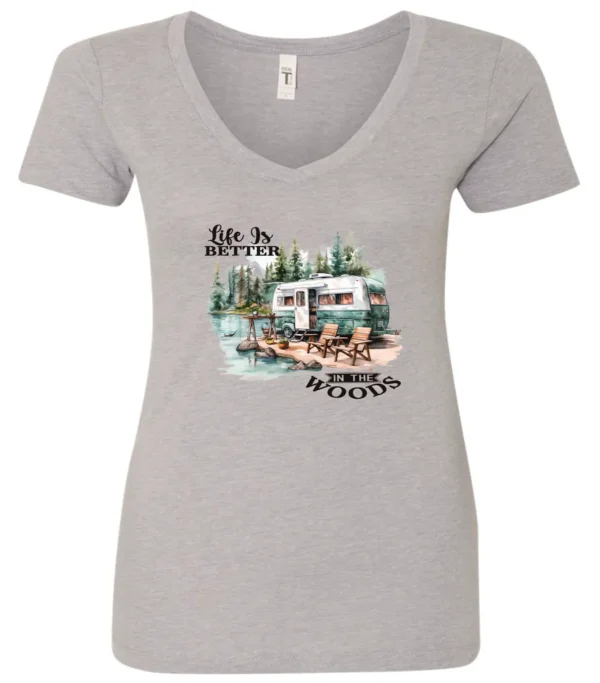 silver Camping graphic v-neck t-shirt featuring a white and red old camper set up by the lake in the woods, and it says life is better in the woods