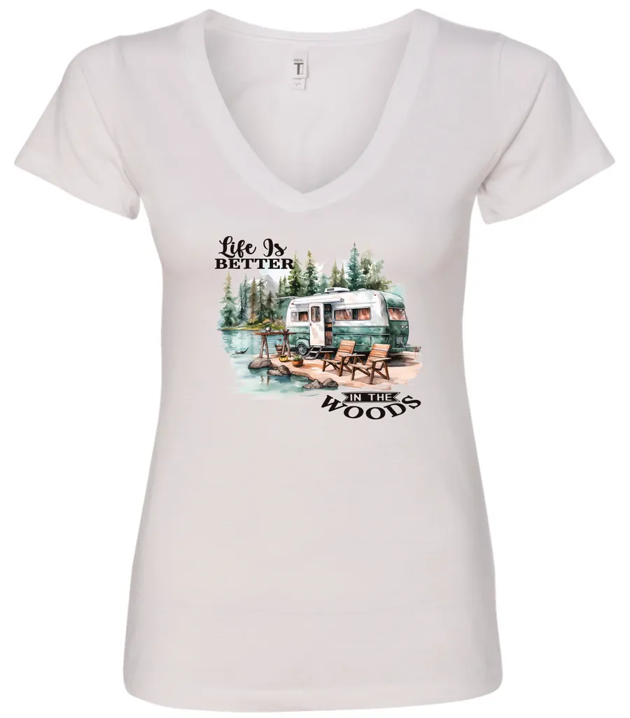white Camping graphic v-neck t-shirt featuring a white and red old camper set up by the lake in the woods, and it says life is better in the woods