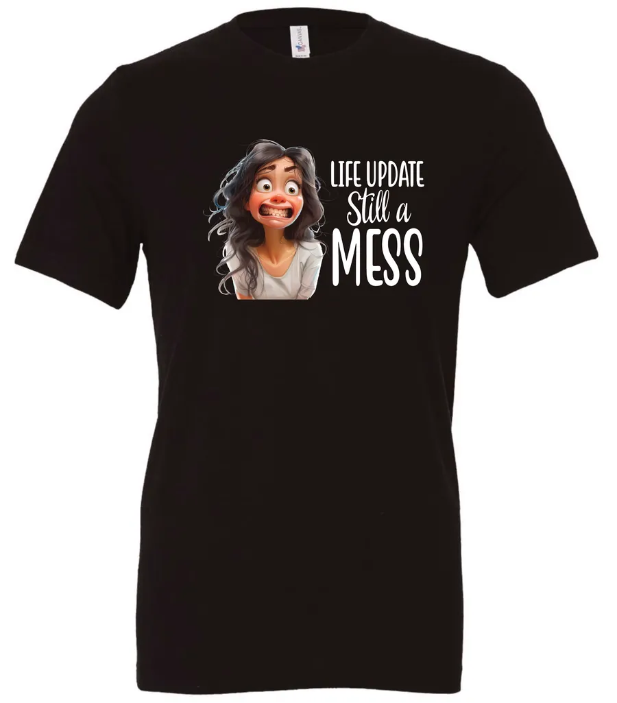black funny saying t-shirt featuring a young girl with long brown hair, with an embarrassed face saying life update, still a mess