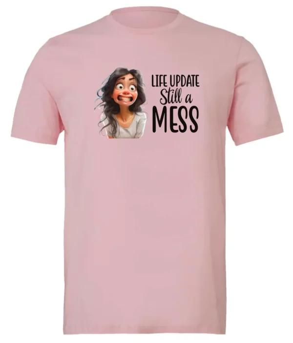 pink funny saying t-shirt featuring a young girl with long brown hair, with an embarrassed face saying life update, still a mess