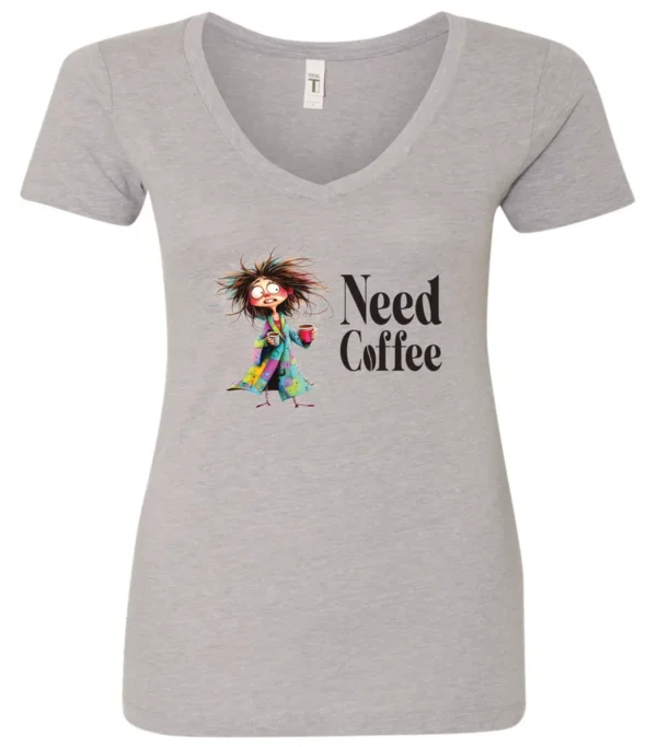 silver funny coffee lover v-neck t-shirt featuring a disheveled young woman in pajamas with two cups of coffee it says need coffee