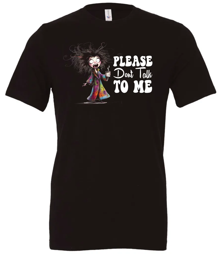 black funny sarcasm t-shirt featuring a woman who has just woken up in pajamas, disheveled, with a cup of coffee in her hand and screaming please don’t talk to me