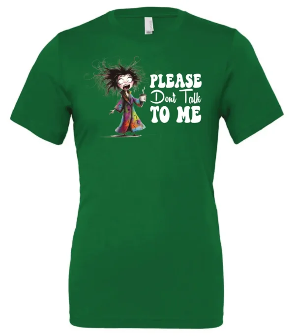 green funny sarcasm t-shirt featuring a woman who has just woken up in pajamas, disheveled, with a cup of coffee in her hand and screaming please don’t talk to me