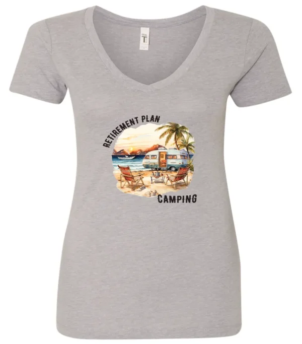 silver funny Camping v-neck t-shirt featuring a camper set up by the beach with the mountain as background, and it says retirement plan: camping