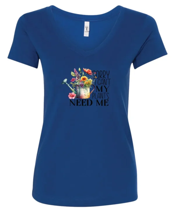 blue garden humor v-neck t-shirt with a watering can used as a flower pot, it has many different flowers and a quote saying sorry i can't, my plants need me