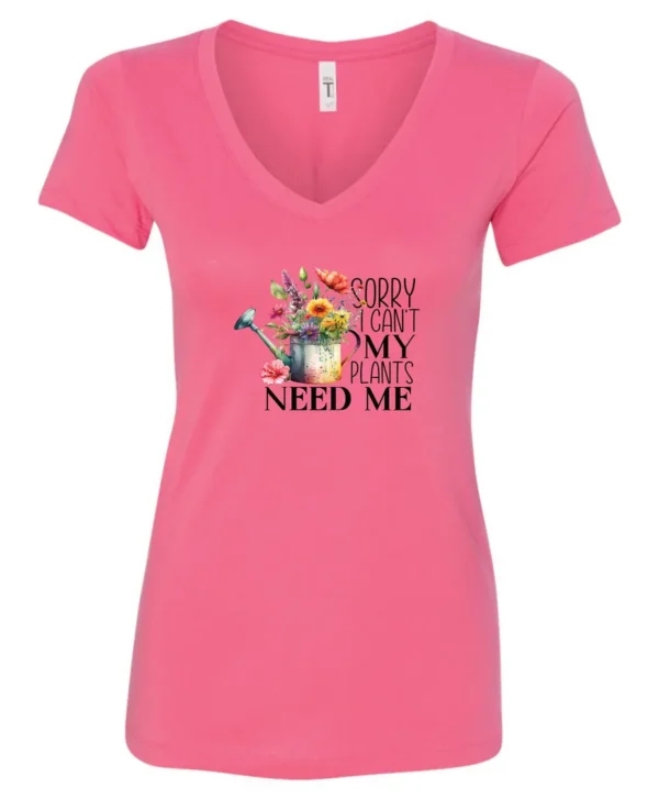 pink garden humor v-neck t-shirt with a watering can used as a flower pot, it has many different flowers and a quote saying sorry i can't, my plants need me
