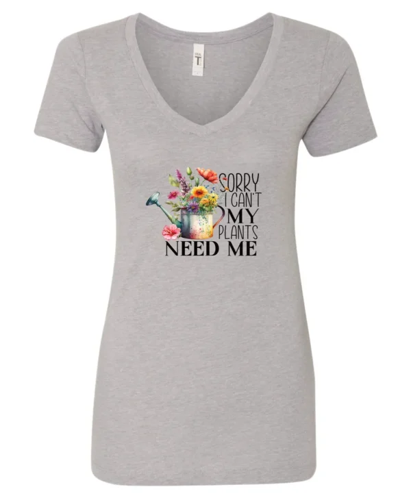 silver garden humor v-neck t-shirt with a watering can used as a flower pot, it has many different flowers and a quote saying sorry i can't, my plants need me